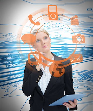 simsearch:6109-06685044,k - Businesswoman considering various applications and holding tablet on blue and white circuit board background Stock Photo - Budget Royalty-Free & Subscription, Code: 400-06876581