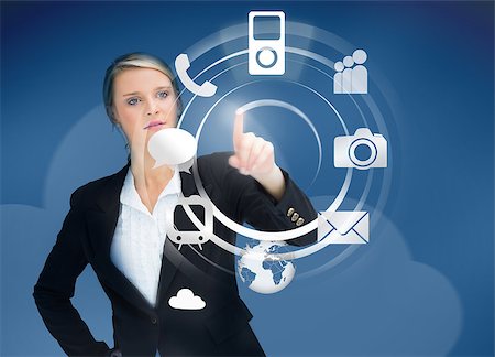 simsearch:6109-06685044,k - Businesswoman using wheel application interface on blue background Stock Photo - Budget Royalty-Free & Subscription, Code: 400-06876583