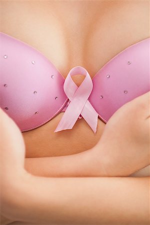 simsearch:400-07835111,k - Closeup of woman in bra with breast cancer awareness ribbon Stock Photo - Budget Royalty-Free & Subscription, Code: 400-06870720
