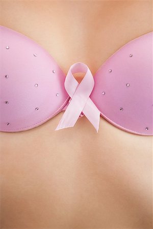 simsearch:400-07835111,k - Closeup of woman in bra with breast cancer awareness ribbon Stock Photo - Budget Royalty-Free & Subscription, Code: 400-06870721
