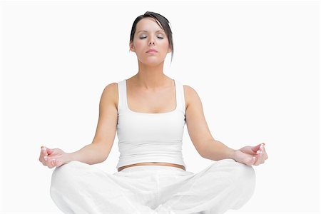 simsearch:400-06872329,k - Young woman sitting in lotus position over white background Stock Photo - Budget Royalty-Free & Subscription, Code: 400-06871999