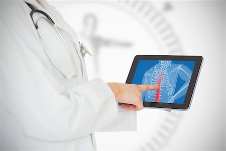 Doctor showing her tablet with red spin Stock Photo - Budget Royalty-Free & Subscription, Code: 400-06873497