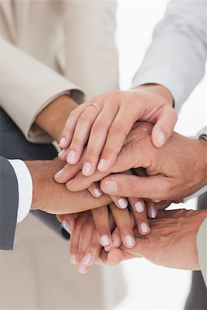 Business teams hands together in unity Stock Photo - Budget Royalty-Free & Subscription, Code: 400-06884367