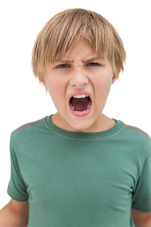Furious little boy shouting on white background Stock Photo - Budget Royalty-Free & Subscription, Code: 400-06885147