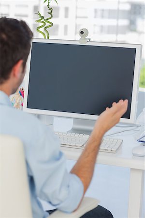 Designer having a video chat in his office on his computer Stock Photo - Budget Royalty-Free & Subscription, Code: 400-06885294