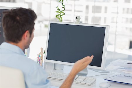 Designer having a video chat on his computer Stock Photo - Budget Royalty-Free & Subscription, Code: 400-06885293