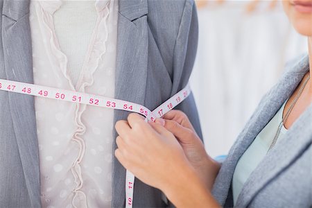 self-employed (female) - Fashion designer measuring blazer with measuring tape Stock Photo - Budget Royalty-Free & Subscription, Code: 400-06885480