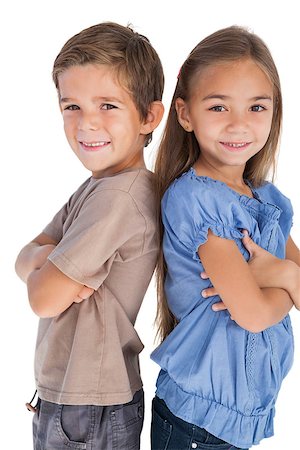 Children standing back to back with their arms crossed on white background Stock Photo - Budget Royalty-Free & Subscription, Code: 400-06885744