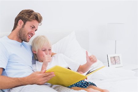 simsearch:400-06872329,k - Father reading a story to son in bed Stock Photo - Budget Royalty-Free & Subscription, Code: 400-06886555