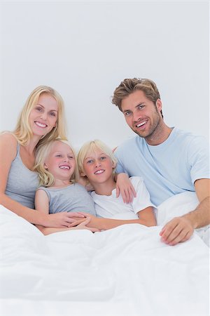 simsearch:400-06872329,k - Portrait of a happy family relaxing in bed Stock Photo - Budget Royalty-Free & Subscription, Code: 400-06886581