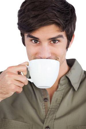 Portrait of man drinking coffee on a white background Stock Photo - Budget Royalty-Free & Subscription, Code: 400-06889116