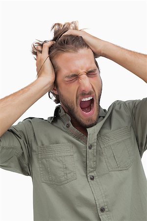 Tired man yawning and running fingers through hair on white background Stock Photo - Budget Royalty-Free & Subscription, Code: 400-06880192