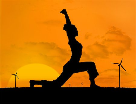 Silhouette of woman doing yoga with wind turbines on the background under sunset Stock Photo - Budget Royalty-Free & Subscription, Code: 400-06882350