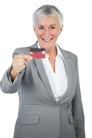 simsearch:400-06858518,k - Smiling businesswoman showing her credit card on white background Stock Photo - Budget Royalty-Free & Subscription, Code: 400-06890864