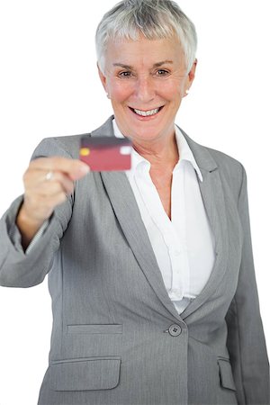 simsearch:400-06858518,k - Happy businesswoman showing her credit card on white background Stock Photo - Budget Royalty-Free & Subscription, Code: 400-06890865