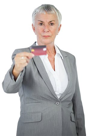 simsearch:400-06858518,k - Serious businesswoman showing her credit card on white background Stock Photo - Budget Royalty-Free & Subscription, Code: 400-06890863