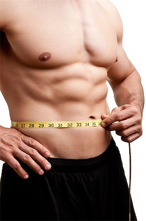 simsearch:400-06480033,k - Fit man measuring his waist after a workout in the gym, isolated in a white background Foto de stock - Super Valor sin royalties y Suscripción, Código: 400-06914117