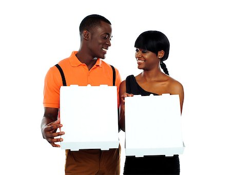 Happy couple holding pizza and looking at each other Photographie de stock - Aubaine LD & Abonnement, Code: 400-06914916