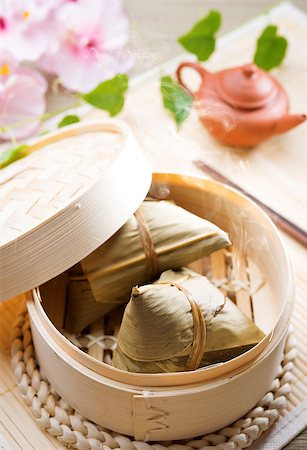 dim sum basket - Rice dumpling or zongzi. Traditional steamed sticky  glutinous rice dumplings. Chinese food dim sum. Asian cuisine. Stock Photo - Budget Royalty-Free & Subscription, Code: 400-06915060
