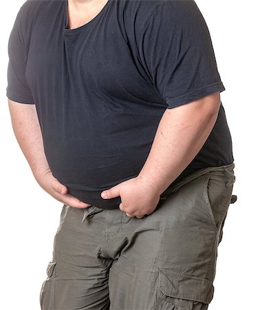 simsearch:400-06915547,k - Fat man with a big belly, close-up part of the body Foto de stock - Super Valor sin royalties y Suscripción, Código: 400-06915545