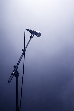 simsearch:400-06954069,k - Microphone waiting for a voice in silhouette on a stage Photographie de stock - Aubaine LD & Abonnement, Code: 400-06918141