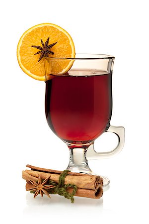 Hot mulled wine with orange slice, anise and cinnamon sticks. Isolated on white Stock Photo - Budget Royalty-Free & Subscription, Code: 400-06919097