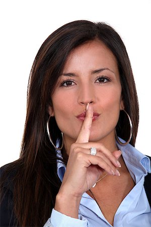 Businesswoman gesturing for silence Stock Photo - Budget Royalty-Free & Subscription, Code: 400-06912188