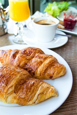 simsearch:400-05704519,k - Breakfast with coffee and croissants in a basket on table Stock Photo - Budget Royalty-Free & Subscription, Code: 400-06924283