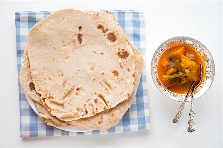 simsearch:400-07418409,k - Chapatti roti or Flat bread and curry dahl. Indian food on dining table. Stock Photo - Budget Royalty-Free & Subscription, Code: 400-06924796