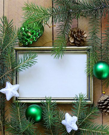 Christmas green fir tree  branches with beautiful decorations on wooden background Stock Photo - Budget Royalty-Free & Subscription, Code: 400-06927674