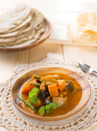 simsearch:400-07418409,k - Vegetable curry dhal, chapatti roti or Flat bread and papadom. Indian food on dining table. Stock Photo - Budget Royalty-Free & Subscription, Code: 400-06927756