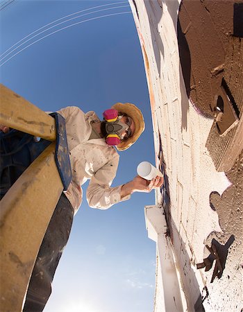 Wide angle view of graffiti artist on ladder making a mural Stock Photo - Budget Royalty-Free & Subscription, Code: 400-06921875