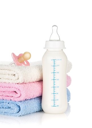 simsearch:400-06751007,k - Baby bottle, pacifier and towels. Isolated on white background Stock Photo - Budget Royalty-Free & Subscription, Code: 400-06922298