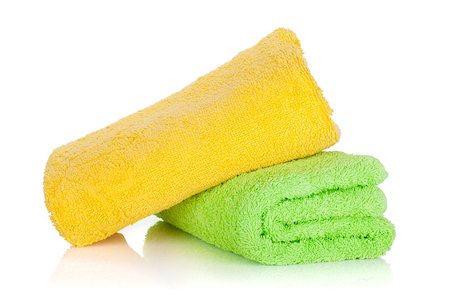 Green and yellow towels. Isolated on white background Photographie de stock - Aubaine LD & Abonnement, Code: 400-06922394