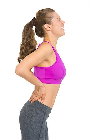 Fitness young woman with back pain Stock Photo - Budget Royalty-Free & Subscription, Code: 400-06922570