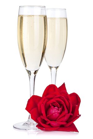 simsearch:400-07166551,k - Two champagne glasses and rose. Isolated on white background Stock Photo - Budget Royalty-Free & Subscription, Code: 400-06923204