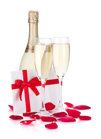 simsearch:400-07166551,k - Two champagne glasses, letter and rose petals. Isolated on white background Stock Photo - Budget Royalty-Free & Subscription, Code: 400-06923205