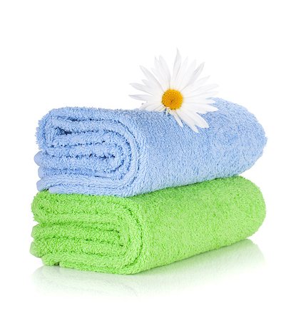 Blue and green towels and camomile flower. Isolated on white background Photographie de stock - Aubaine LD & Abonnement, Code: 400-06923521