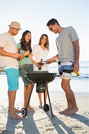 simsearch:6109-06781569,k - Happy young friends having barbecue together on the beach Stock Photo - Budget Royalty-Free & Subscription, Code: 400-06930602
