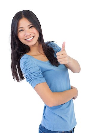 Happy asian woman giving thumb up at camera on white background Stock Photo - Budget Royalty-Free & Subscription, Code: 400-06931045