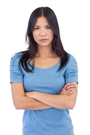 Annoyed asian woman with arms crossed on white background Stock Photo - Budget Royalty-Free & Subscription, Code: 400-06931040