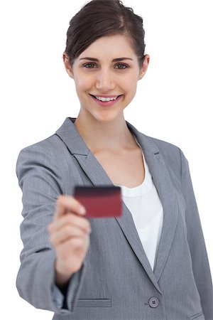 simsearch:400-06858518,k - Smiling businesswoman holding credit card on white background Stock Photo - Budget Royalty-Free & Subscription, Code: 400-06931979
