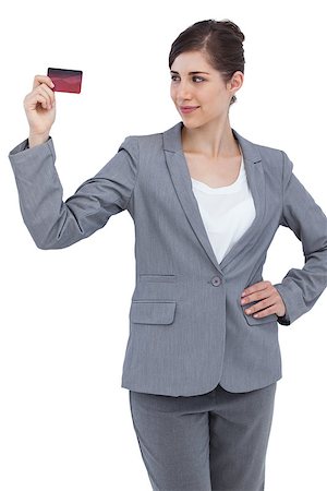 simsearch:400-06858518,k - Confident businesswoman with red credit card on white background Stock Photo - Budget Royalty-Free & Subscription, Code: 400-06931982