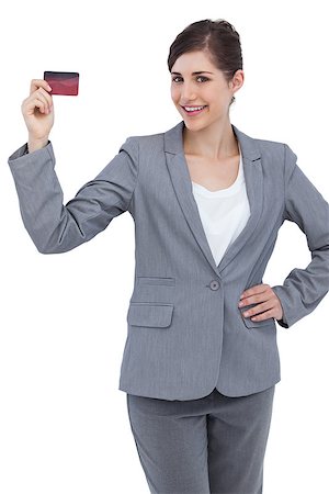 simsearch:400-06858518,k - Smiling businesswoman with red credit card on white background Stock Photo - Budget Royalty-Free & Subscription, Code: 400-06931983