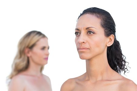 Thoughtful brunette on foreground with blonde on behind  on white background Foto de stock - Super Valor sin royalties y Suscripción, Código: 400-06932972