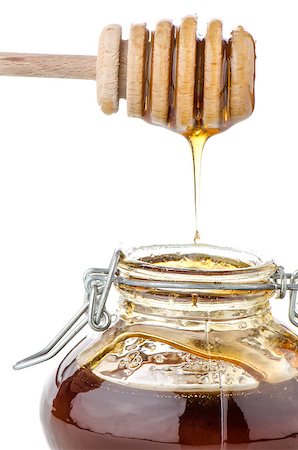 simsearch:400-05135233,k - Jar of honey with wooden drizzler isolated on white background Foto de stock - Super Valor sin royalties y Suscripción, Código: 400-06948044