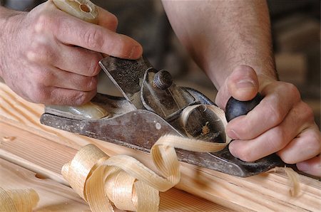 Man hands with carpenters plane on wooden background Stock Photo - Budget Royalty-Free & Subscription, Code: 400-06948279