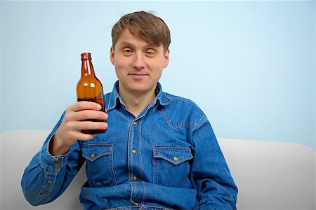 drunken - Man relaxing with a bottle of beer at home Stock Photo - Budget Royalty-Free & Subscription, Code: 400-06948788