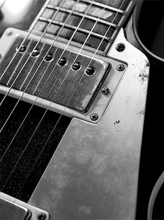 fret - Macro abstract photo of the pickups and strings of an electric guitar. Stock Photo - Budget Royalty-Free & Subscription, Code: 400-06954674
