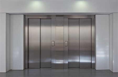 simsearch:400-04333419,k - Two brushed metal elevator doors in a minimalistic style building interior Stock Photo - Budget Royalty-Free & Subscription, Code: 400-06954724